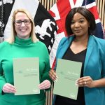 Photo of Louise Graham (CC Manager) and DPCC Nicolle Ndiweni-Roberts holding up copies of the new 'Your Journey - Derbyshire' guide