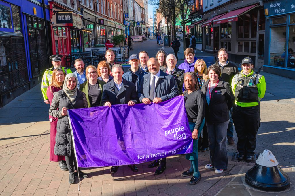 Representatives from the Night Time economy stand with Gary Godden, Nottinghamshire Police and Crime Commissioner in Hockley, with the Purple Flag.