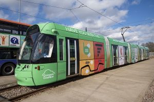 Close up of the tram wrapped in the A-Z of Consent