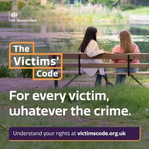image Picture of two women on a park bench overlooking a pond. In white writing 'The Victim's Code. For every victim, whatever the crime.'